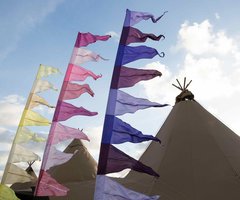 Flags outside a tipi - Sarah Lauren Photography